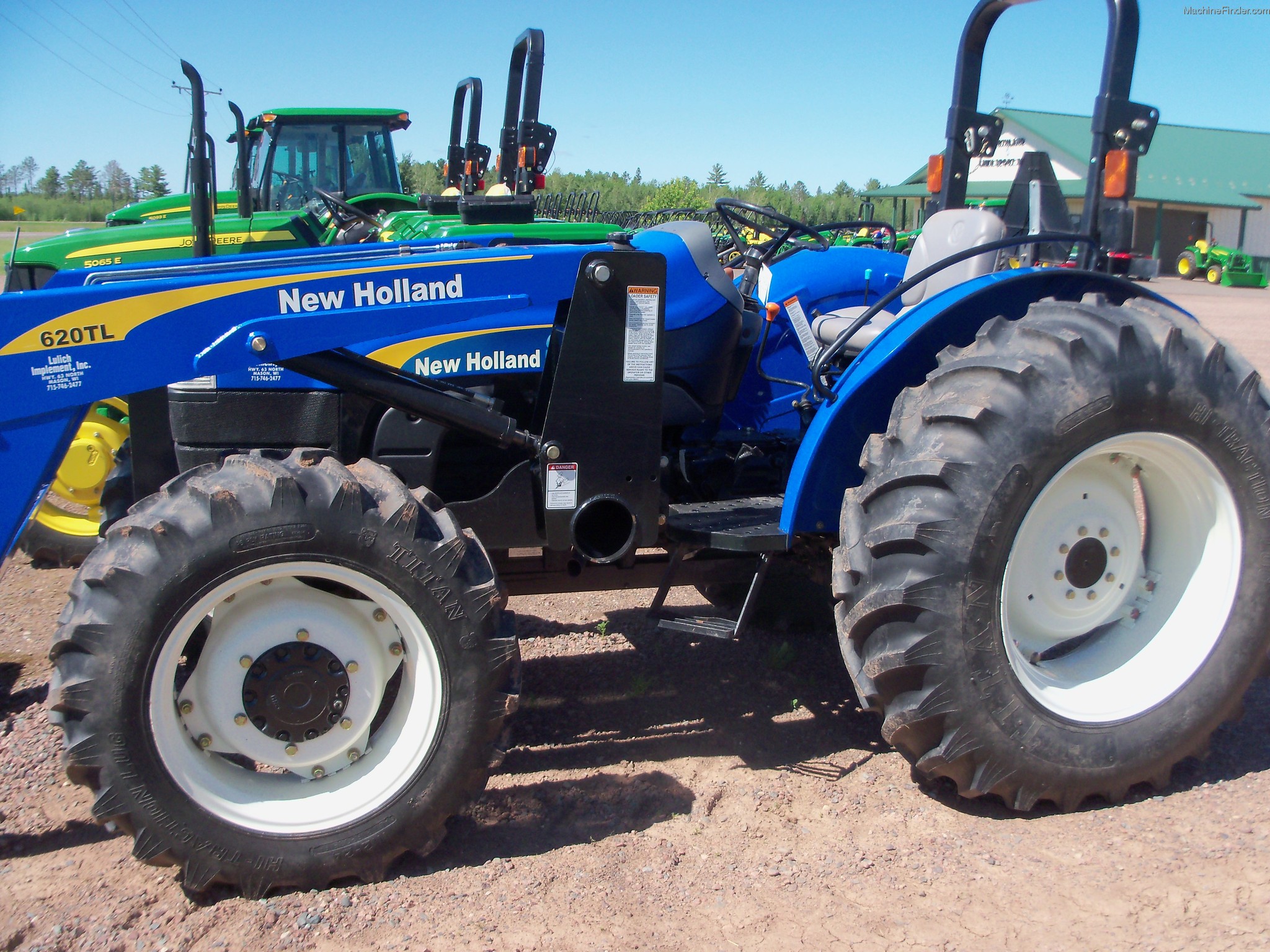 2009 New Holland TT75A Tractors Utility (40100hp) John Deere